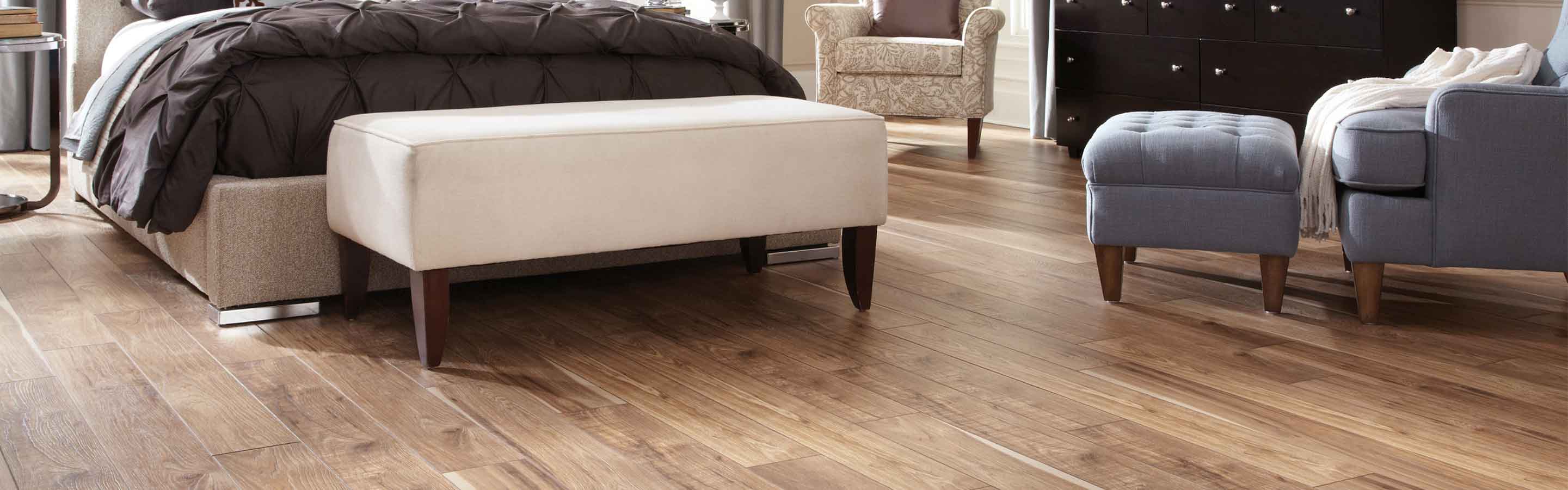 Laminate flooring in bathroom with sink and table