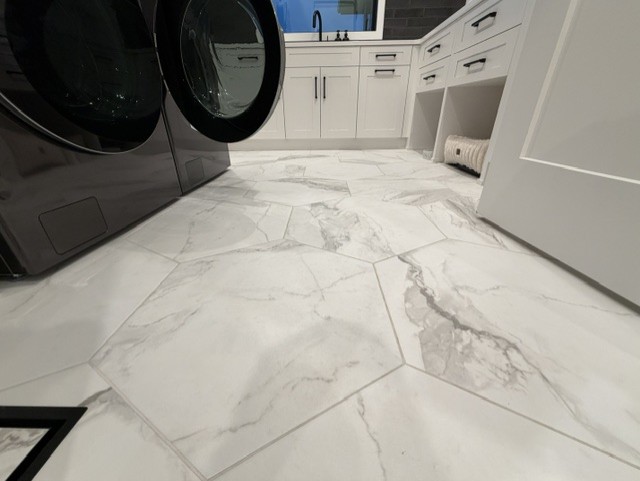 Hexagonal tile flooring in a laundry room