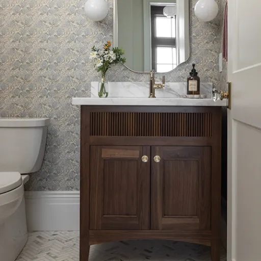 Bathroom vanity with neutral wallpaper 